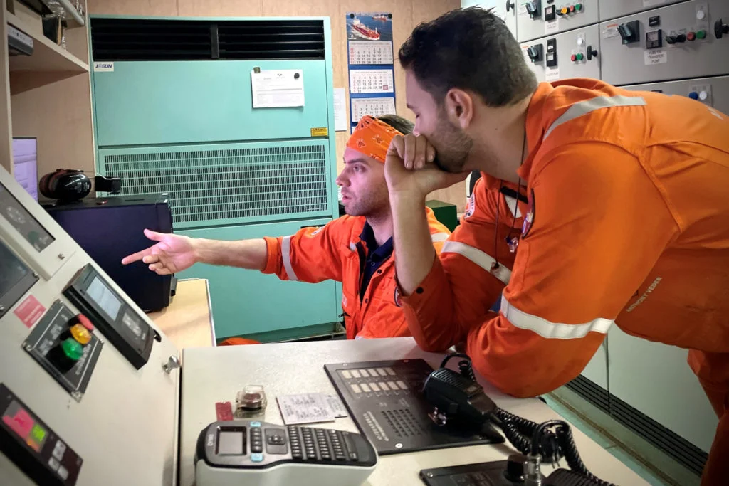 Maritime workers receiving training on a vessel